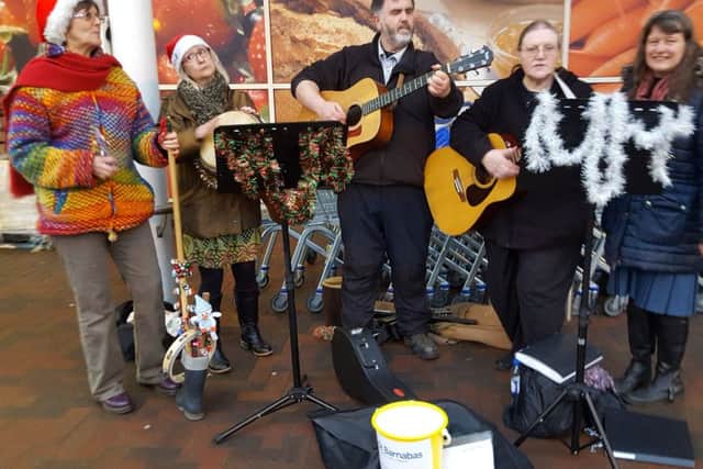 Da Capo busking for St Barnabas EMN-180119-083104001