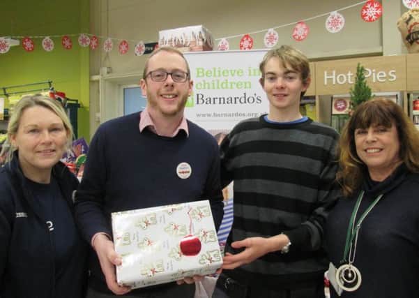 Pictured, from left -  Lesley Sargeant, Store Community Champion; Stephen Craig, Store Manager; care leaver Connor Patten and Jackie Taylor, Barnardos Team Manager. EMN-180119-162442001