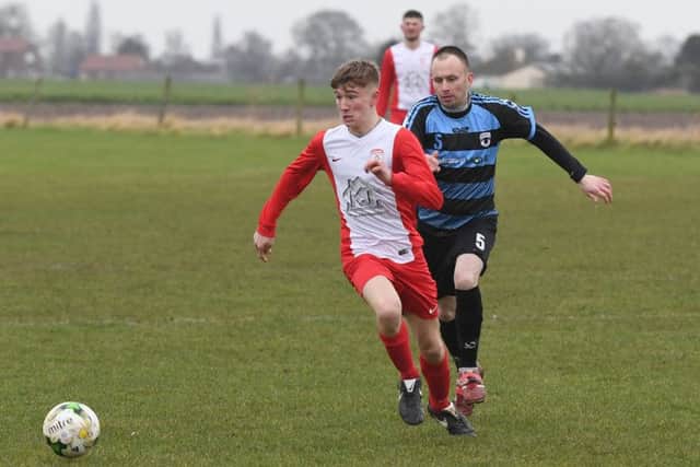 Leverton Res (blue) v Digby FC (red). Gavin Gregory (blue), Harvey Shreves (red).