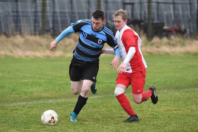 Leverton Res (blue) v Digby FC (red). Aaron Smith (blue), Lewis Jones (red).