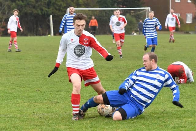 Benington (blue) v Skegness Town Res (red). Carl Wilson (blue), Carter Godson (red).