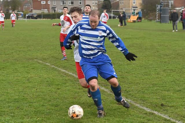 Benington (blue) v Skegness Town Res (red). Carl Wilson (blue), Carter Godson (red).