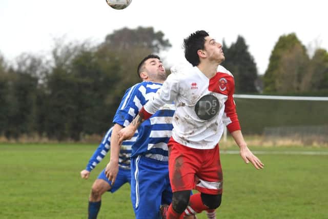 Benington (blue) v Skegness Town Res (red). George Dix (blue), Jordon Turner (red).