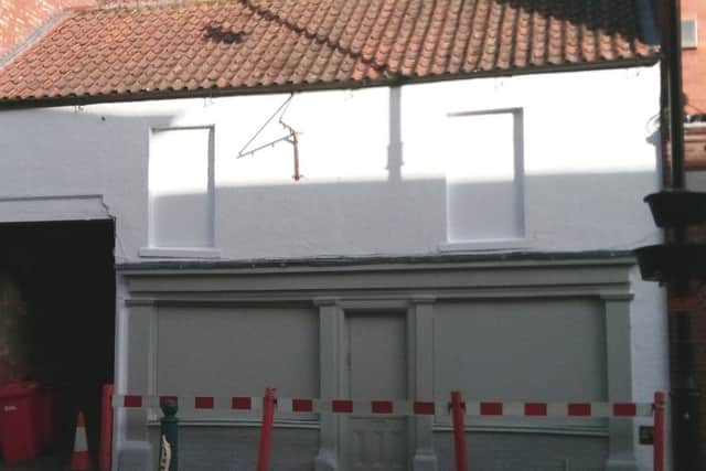 Getting a facelift. The neglected former Pizza Hot premises is a listed building, but has undergone an enforced tidy up. EMN-180122-172858001