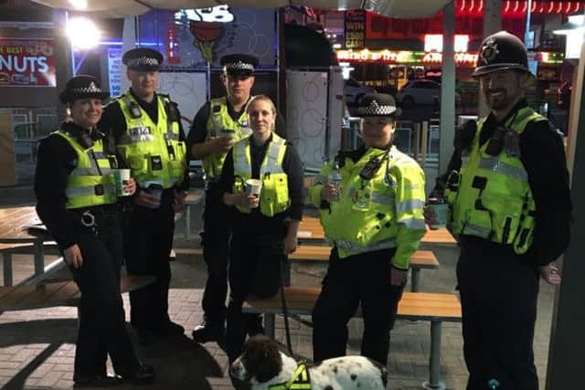 T/Insp Matt Bennison (right) with his officers during a special operation in the resort. ANL-180123-120051001