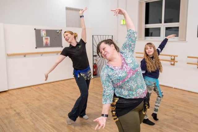 Belly dancing classes with Emma Giles owner of Zest dance and fitness, Marie Betts, instructor, and Lili Betts age 11. EMN-180126-123935001