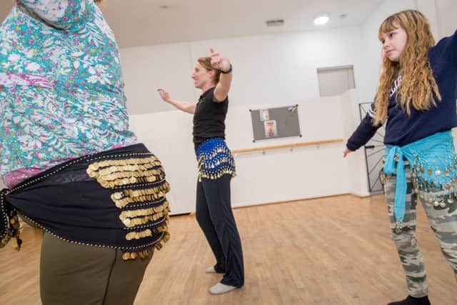 Belly dancing classes with Emma Giles owner of Zest dance and fitness, Marie Betts, instructor, and Lili Betts age 11. EMN-180126-124006001