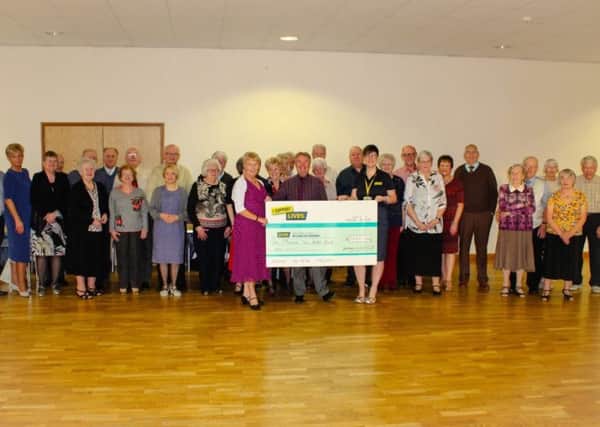 Dancing With KCB present a cheque for Â£1,200 to LIVES First Responders.