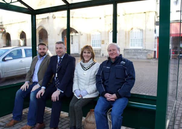 Trying out the new bus shelter in Sleaford Market Place. From left - Coun Richard Davies (LCC), Coun Richard Wright (NKDC Leader), Coun Jan Mathieson (Mayor of Sleaford) and Coun Anthony Brand (Deputy Mayor of Sleaford). EMN-180125-124428001