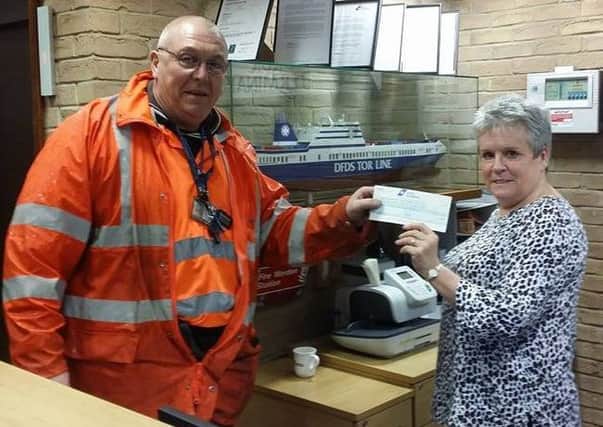 Pat Dye on behalf of DFDS Seaways presents a cheque to Ian Mann for Coastal Access for All (Cafa). ANL-180125-170008001