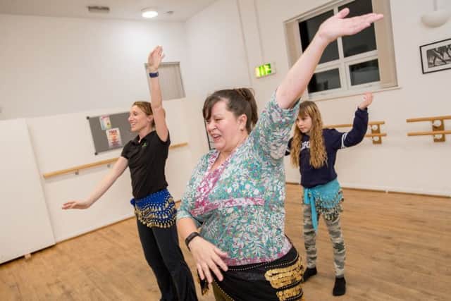 Belly dancing classes with Emma Giles owner of Zest dance and fitness, Marie Betts, instructor, and Lili Betts age 11. EMN-180126-123949001