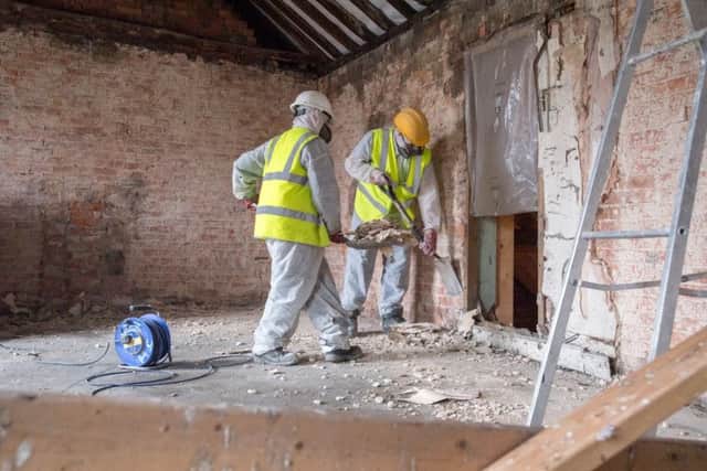 A sneak look behind the scenes at renovation work to 17-19 Market Place in Sleaford. Work on stripping out plaster and rubble from the old draper's shop. EMN-180127-133733001