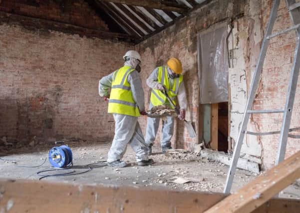 A sneak look behind the scenes at renovation work to 17-19 Market Place in Sleaford. Work on stripping out plaster and rubble from the old draper's shop. EMN-180127-133733001