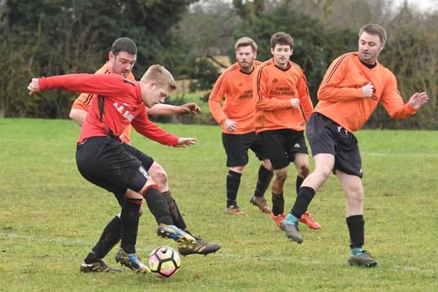 Coningsby Res (red) v Caythorpe (orange). Lucas Payne (red), Robert Walters (orange).