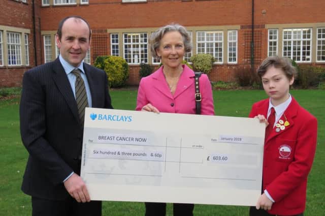 St Hugh's has presented £603.60 to the charity Breast Cancer Now. EMN-180130-125403001
