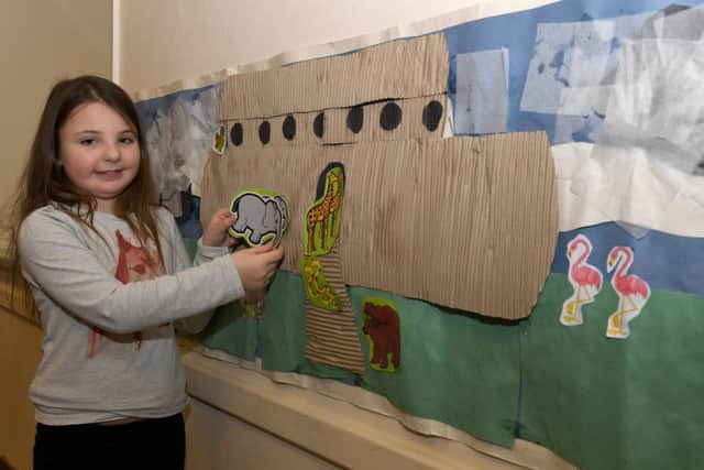 Crafts, activities and stories at St Deny's Church Room, Sleaford. Lexi Young 8 of Sleaford sticking animals on the Ark. EMN-180502-101950001