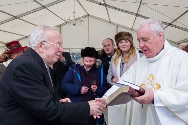 The Rt Revd Christopher Lowson, Bishop of Lincoln cut a commemoration cake and presented David Bramford with a Bible and
Book of Common Prayer to recognise his 38 years of service as churchwarden. EMN-180202-131521001