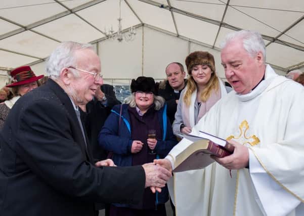 The Rt Revd Christopher Lowson, Bishop of Lincoln cut a commemoration cake and presented David Bramford with a Bible and
Book of Common Prayer to recognise his 38 years of service as churchwarden. EMN-180202-131521001