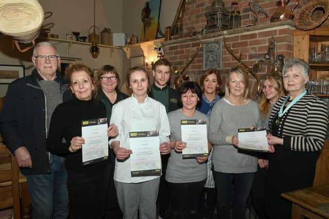 Staff of Abbey Parks Farm Shop, presented with certificates by Heckington Parish Council chairman, Jan Plamer, after training to use a defibrilator that is to be fitted at the shop for villagers to use. L-R Mike West - councillor, Diane Cooke, Louise Atkinson, Jess Bell, Jimmy Harris, Tracy Fryer, Kate Brown, Ros Loweth, Lucy Bell, Jan Palmer. EMN-180502-171642001