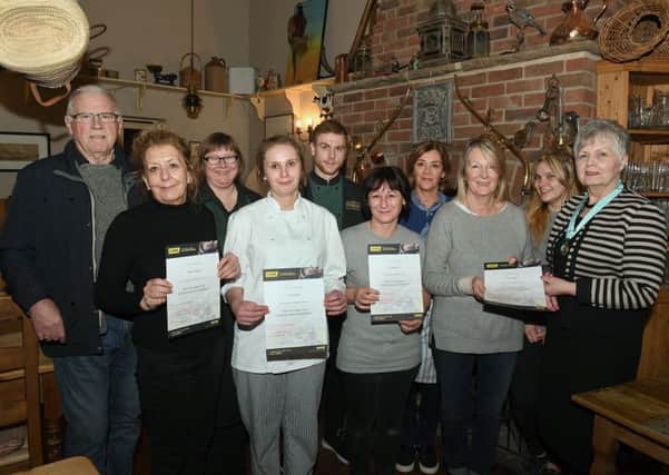 Staff of Abbey Parks Farm Shop, presented with certificates by Heckington Parish Council chairman, Jan Plamer, after training to use a defibrilator that is to be fitted at the shop for villagers to use. L-R Mike West - councillor, Diane Cooke, Louise Atkinson, Jess Bell, Jimmy Harris, Tracy Fryer, Kate Brown, Ros Loweth, Lucy Bell, Jan Palmer. EMN-180502-171642001
