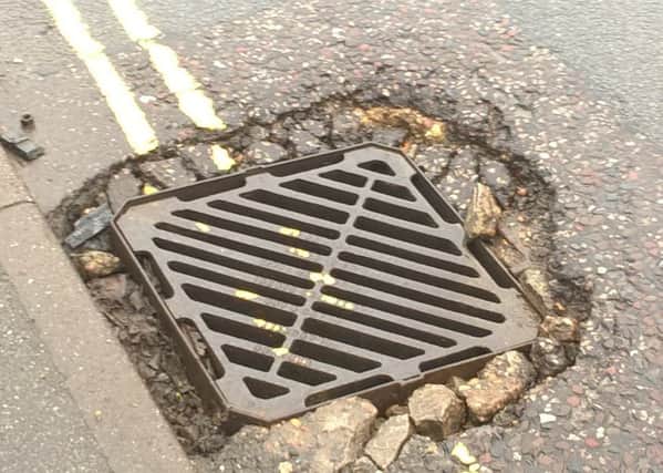 The damaged drain and gulley - it will be repaired says councillor.