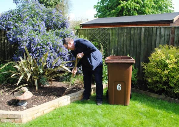 Satisfied customer Charlie Pearce in his smart Butterwick garden with his garden waste bin.