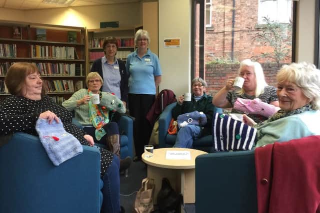 Twiddle muffs: Louth Librarys Knit and Knatter group has been busy knitting.