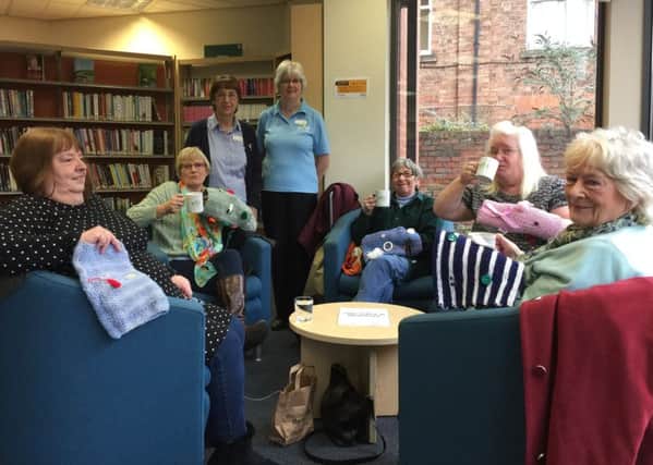 Twiddle muffs: Louth Librarys Knit and Knatter group has been busy knitting.