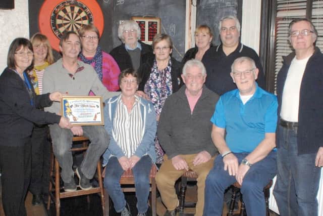 On behalf of Coningsby & Tattershall Lions Club, President Pat thanked the Black Horse and their generous customers for helping to raise ?899 for charity at the Festive Beard Shave and presented them with a Certificate of Appreciation EMN-181202-074252001