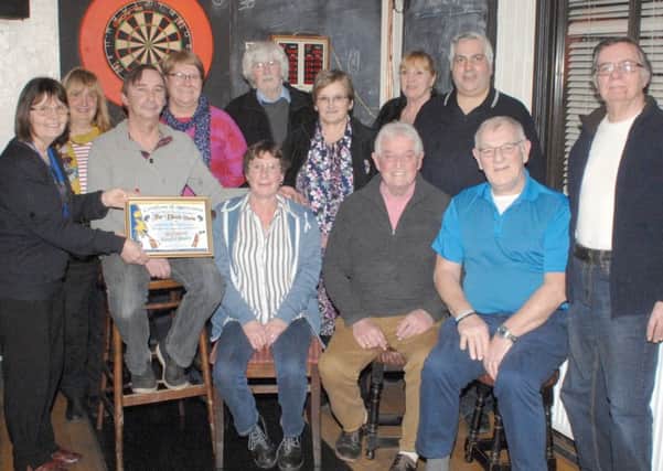 On behalf of Coningsby & Tattershall Lions Club, President Pat thanked the Black Horse and their generous customers for helping to raise ?899 for charity at the Festive Beard Shave and presented them with a Certificate of Appreciation EMN-181202-074252001