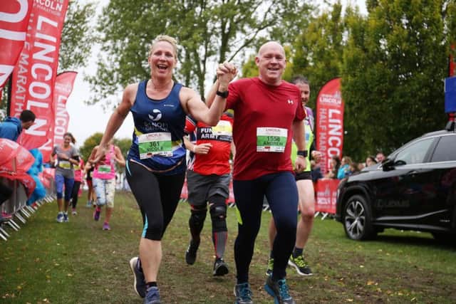 Runners crossing the finish line during last year's Lincoln Half Marathon. EMN-180502-094621001