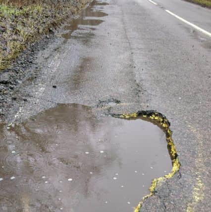 A close up of the pothole on Tealby Road. Picture: Steve Green. EMN-180502-125745001