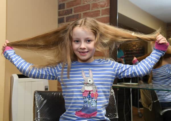 Maisie Hurst 7 of New Bollingbroke, having her hair cut off for Prince's Trust, at Hair and Beauty by Kimberley, Coningsby. pictured before the cut. PICTURE: David Dawson.