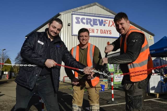 Cutting the chain to officially open the new Screwfix store is Jamie Griffiths (Manager), Stuart Mawson (SP Joinery) and Patrick Lynch (SP Joinery).