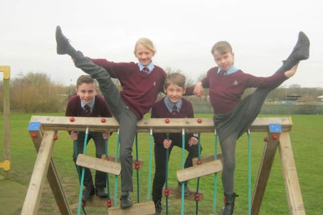 William Alvey pupils celebrate their Lottery bid success on the latest section of their trim trail installed last year. EMN-180902-135931001