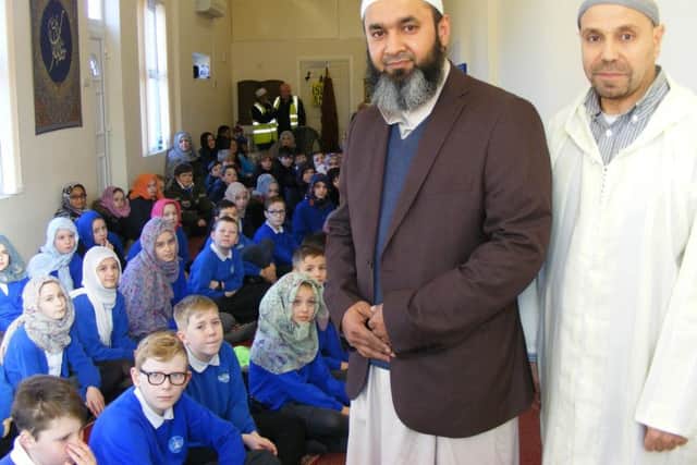 Members of the Sleaford Muslim Community Association, Noureddine Belazia and Albabul Islam, welcome St Botolph's School pupils to their prayer hall. EMN-180802-165037001