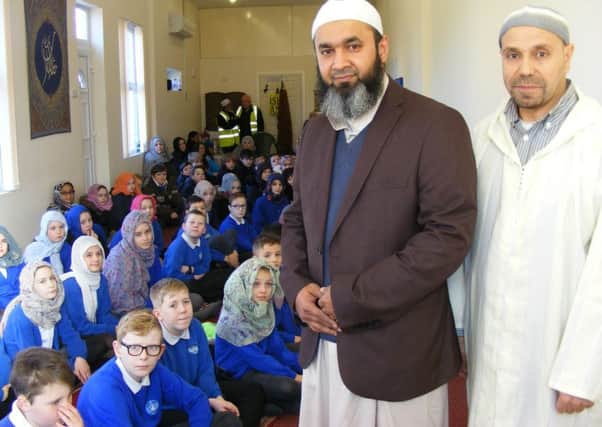 Members of the Sleaford Muslim Community Association, Noureddine Belazia and Albabul Islam, welcome St Botolph's School pupils to their prayer hall. EMN-180802-165037001