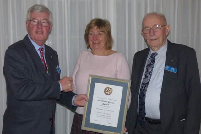 Rotary award: Pictured is president Bill Wood, Linda Blankley and John Barker.