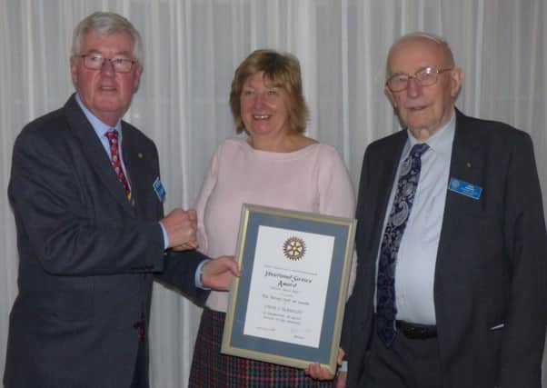 Rotary award: Pictured is president Bill Wood, Linda Blankley and John Barker.