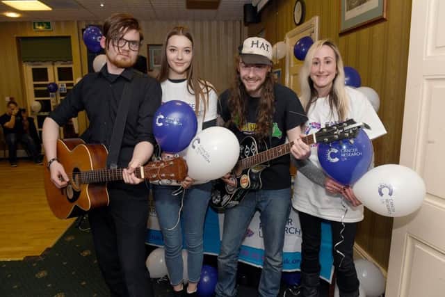 Accoustic night at Solo Club, fundraiser for Cancer Research, backed by WHSmith. L-R Ryan Watson organiser, Francesca Winfield of WHSmith, Dan Hibbert - organiser, Hannah Hankinson - WHSmith. EMN-180902-113352001