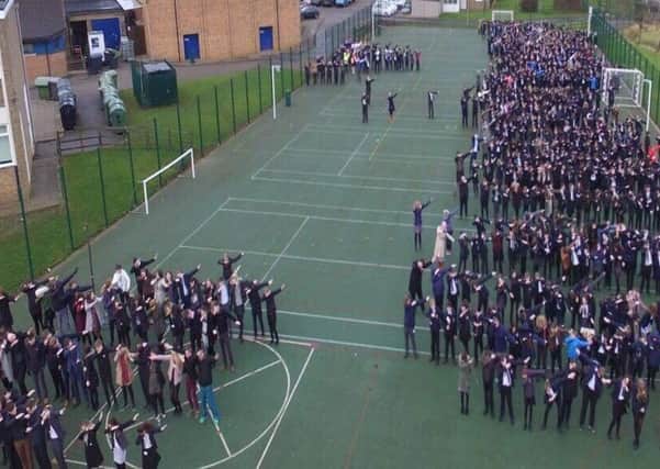 The 'dab' by the whole school at Sir William Robertson Academy during a fire drill, captured on their drone camera. EMN-180902-121147001