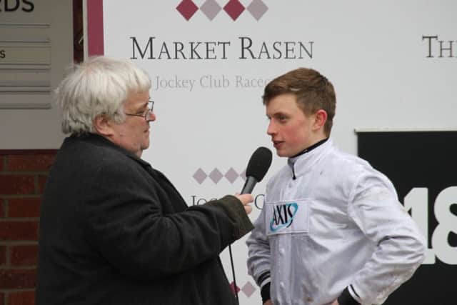 Racecourse presenter Mike Vince interviews rising star James Bowen after his feature race win EMN-181202-105744002