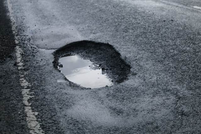 A pothole on the A155 between West Keal and East Kirkby that was reported as 'dangerous' but not filled until the following day. ANL-181202-133038001