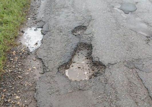 Potholes on Croft Low Road, Skegness. ANL-181202-132435001