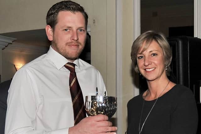 Andrew White collects his award.