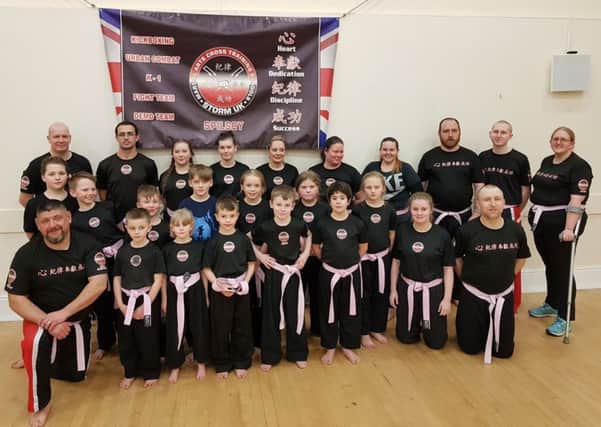 Storm Uk Spilsby bought and wore special pink belts to raise funds for Cancer Research UK