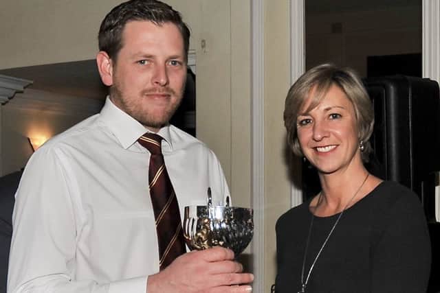 Andrew White collects his award.