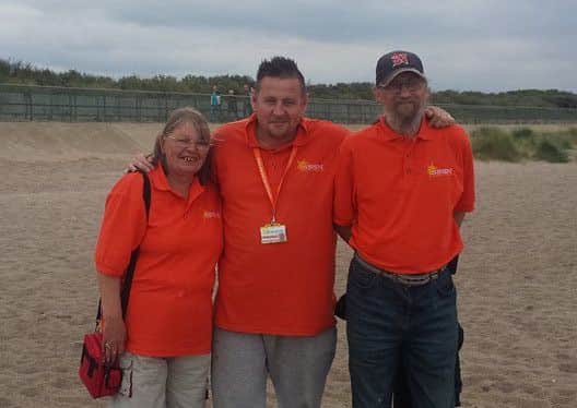 Michael Ryan (centre) and supporters Alison and John Simpson.