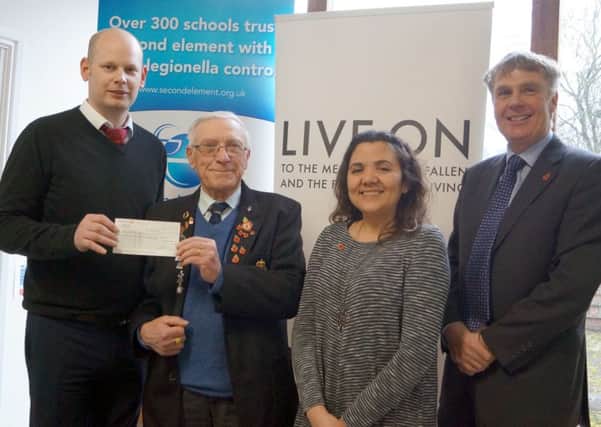 Les Tranter received the cheque from Andrew Spooner, watched by Andrea Fletcher and Nick Fairfax EMN-180219-083022001