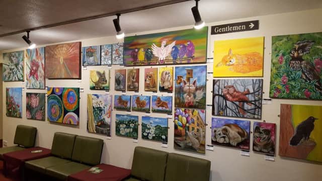 A photograph of the exhibition - Art For A Good State of Mind - featuring artwork produced by Marina Daniluka and Dainis Voldoka. EMN-180216-110154001